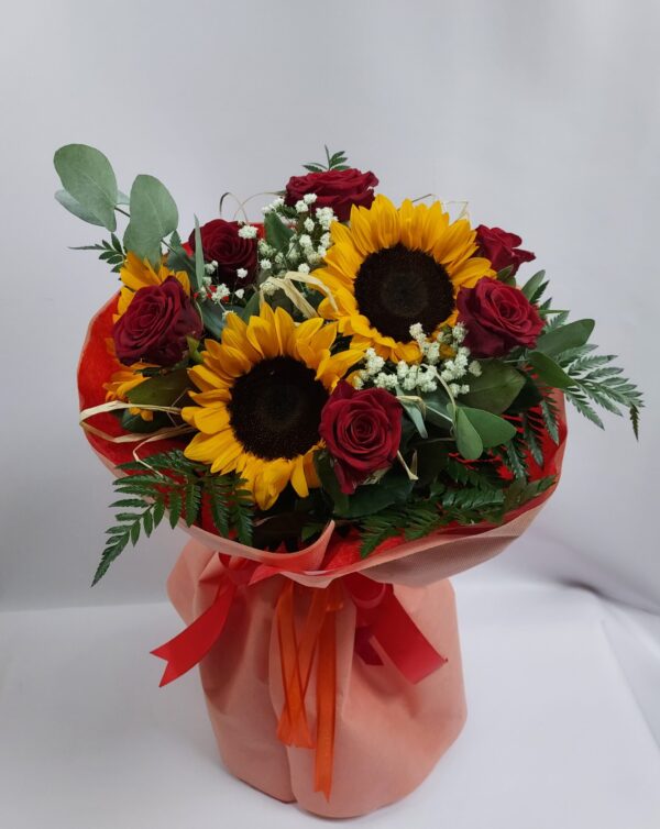 Bouquet of roses, sunflowers, and foliage