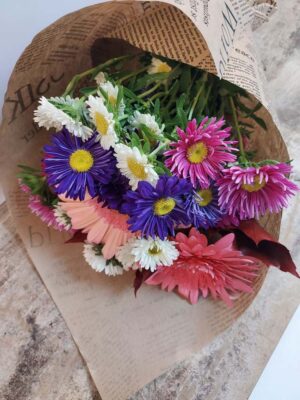 Seasonal bouquet with colored aster and gerberas