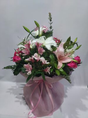 Exuberant bouquet with a variety of flowers and colors.