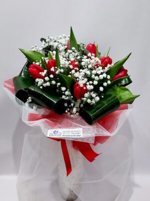 Impressive bouquet with wonderful red tulips, and especially foliage