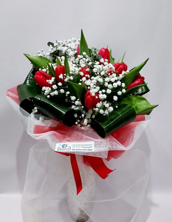 Impressive bouquet with wonderful red tulips, and especially foliage