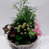 Impressive large composition in a woven wicker basket with beautiful and hardy indoor plants
