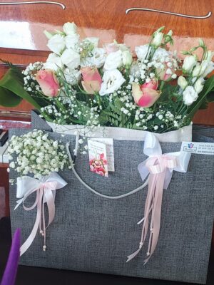 Composition in bag packaging, with fresh wedding or engagement flowers